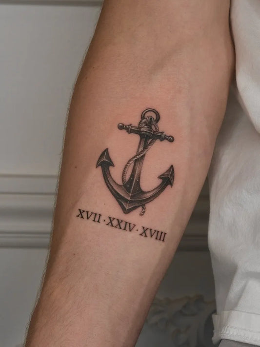 Medium Black and Grey Anchor with Roman Numerals Tattoo on Men Arm by @tattooforest_ed