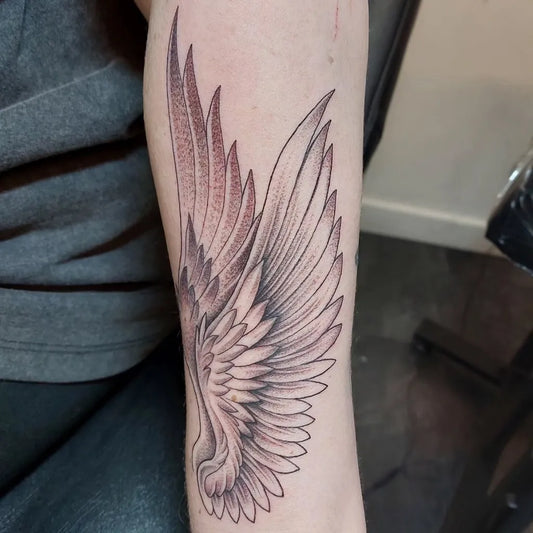 Medium Black and Grey Angel Wings Tattoo on Men Arm by @rancidink