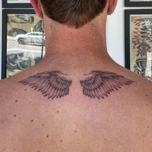 Medium Black and Grey Angel Wings Tattoo on Men Back by @ella_loekito