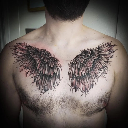 Medium Black and Grey Angel Wings Tattoo on Men Chest by @inkstitution.brownsbay