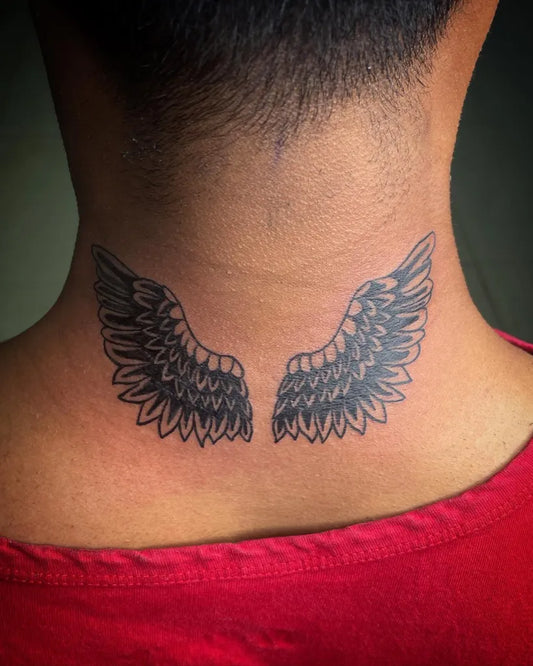 Medium Black and Grey Angel Wings Tattoo on Men Neck by @tattoo_artist_arathi