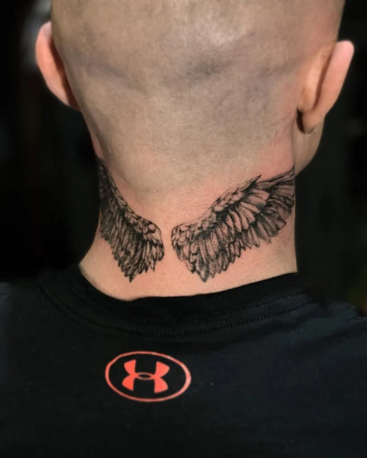 Medium Black and Grey Angel Wings Tattoo on Men Neck by @tinabrendaart