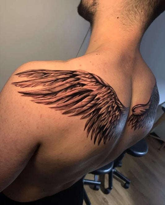 Medium Black and Grey Angel Wings Tattoo on Men Shoulder by @nomoretearstattoo