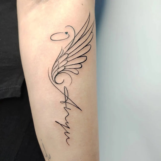 Medium Black and Grey Angel Wings and Name Tattoo on Women Arm by @_nono_tattoo