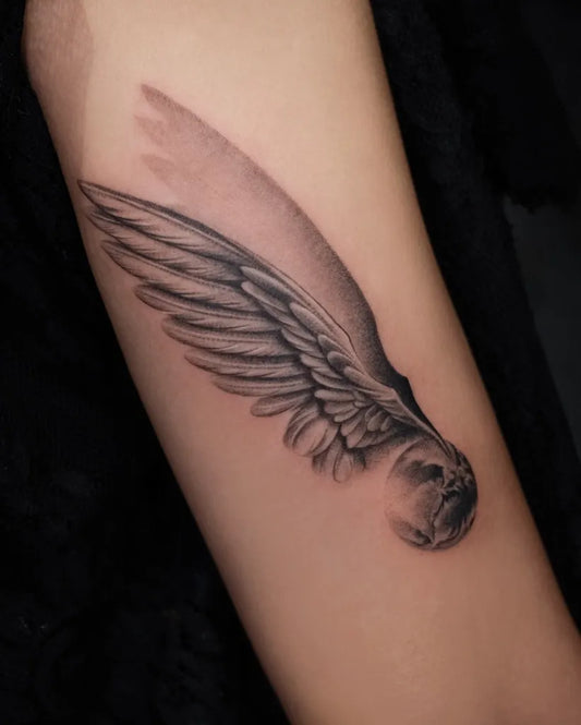 Medium Black and Grey Angel Wings and Skull Tattoo on Women Arm by @zihlan_tattooist