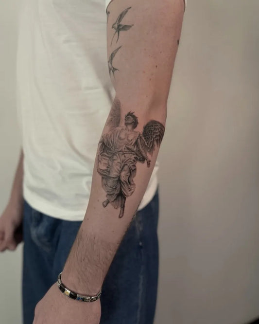 Medium Black and Grey Angel and Flowers on Men Arm Tattoo by @serhatattoo