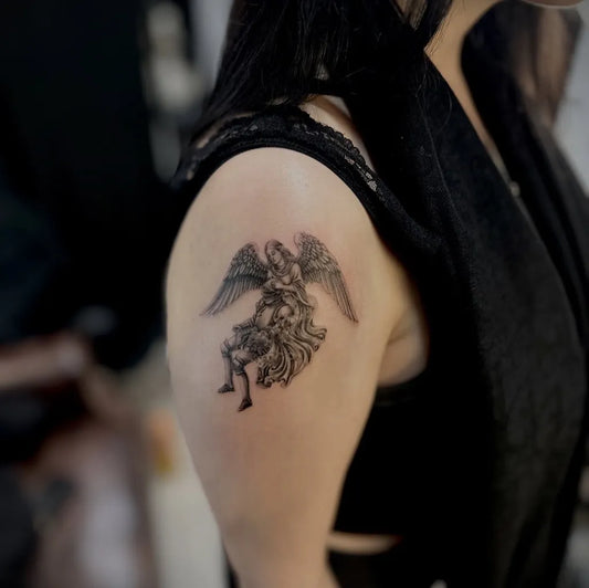 Medium Black and Grey Angel with Wings and Horse Tattoo on Women Shoulder by @farzin.ink.tattoo