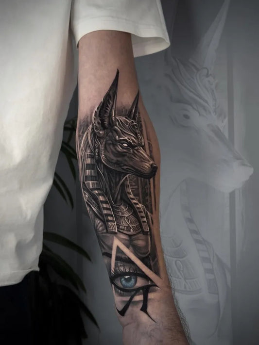 Medium Black and Grey Anubis Eye Pyramid Tattoo on Men Arm by @notfound_tattoo
