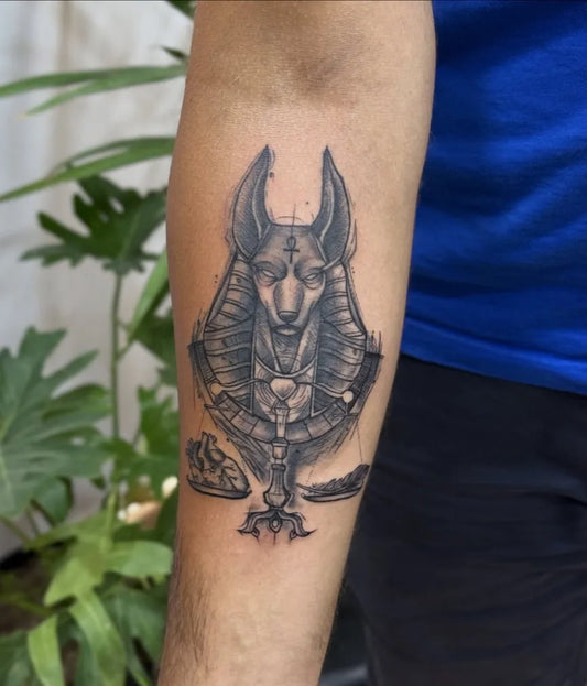 Medium Black and Grey Anubis Scales Heart Tattoo on Men Arm by @dr_g_tattoo_hurghada