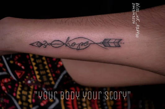 Medium Black and Grey Arrow Hope Tattoo on Men Forearm by @bliss_ink_tattoo