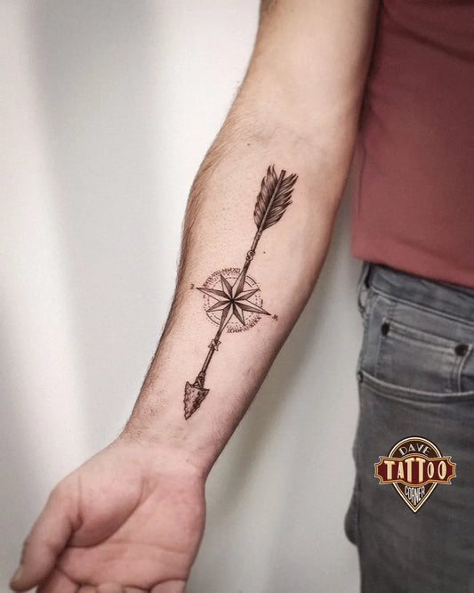 Medium Black and Grey Arrow and Compass Tattoo on Men Arm by @dave_tattoo_corner