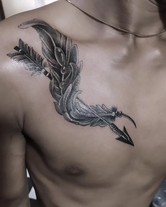 Medium Black and Grey Arrow and Feather Tattoo on Men Shoulder by @aji_saka_tattoo_fucktory