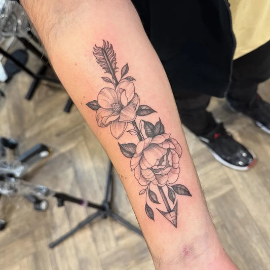 Medium Black and Grey Arrow and Roses Tattoo on Men Arm by @alex.niamh.tattoos