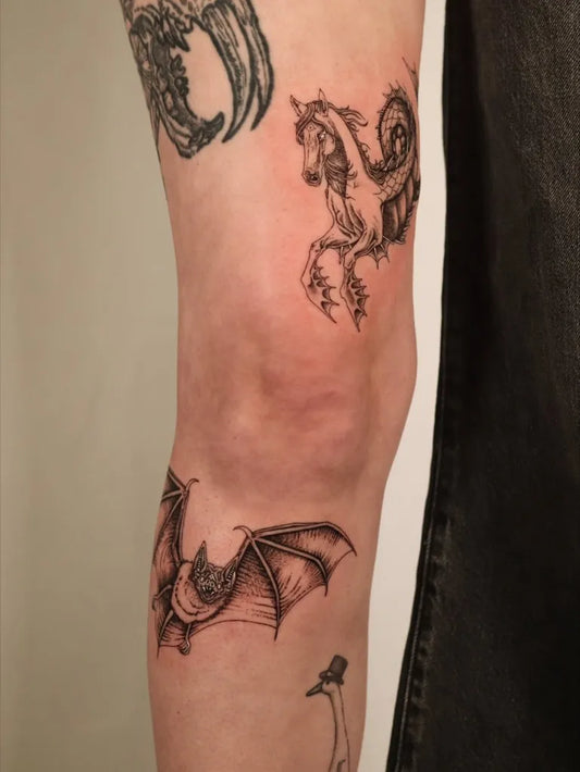 Medium Black and Grey Bat Dragon Unicorn Tattoo on Women Thigh by @swampbodytattoo