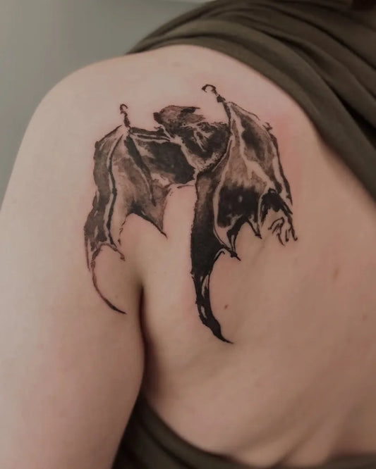 Medium Black and Grey Bat Wings Tattoo on Women Shoulder by @eumji_ink