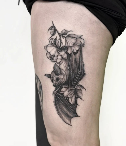 Medium Black and Grey Bat and Flowers Tattoo on Women Thigh by @jessicajadetattoo