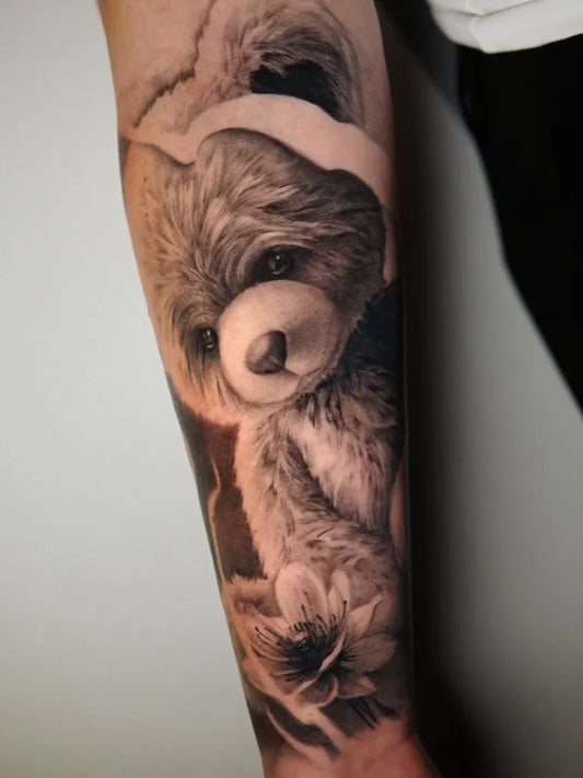 Medium Black and Grey Bear with Lily on Men Arm Tattoo by @yuri_muys_tattoo