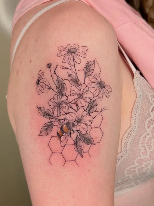 Medium Black and Grey Bee Flowers Honeycomb on Women Shoulder Tattoo by @raissa.ink