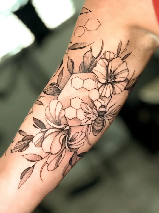 Medium Black and Grey Bee Honeycomb Flowers on Women Arm Tattoo by @david.orozco23