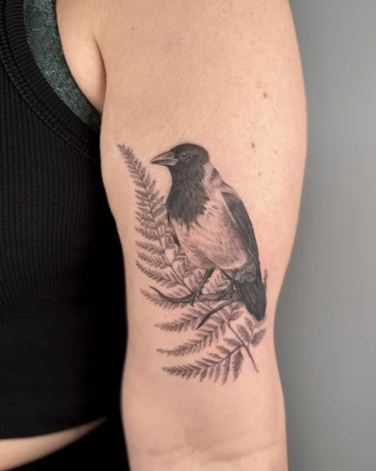 Medium Black and Grey Bird and Fern Tattoo on Women Arm by @meganbirdtattoo