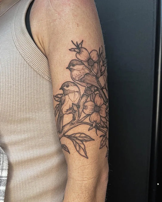 Medium Black and Grey Birds and Flowers Tattoo on Women Arm by @caitgraytattoos