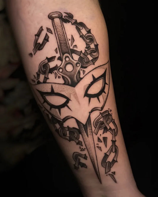 Medium Black and Grey Broken Dagger and Mask Tattoo on Men Forearm by @hammerheart.tattoos