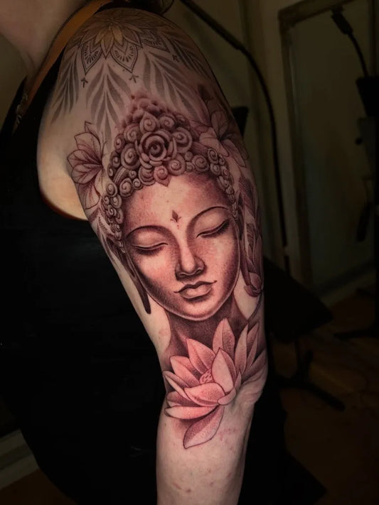 Medium Black and Grey Buddha and Lotus Spiritual Tattoo on Women Shoulder by @ayla.tattoos