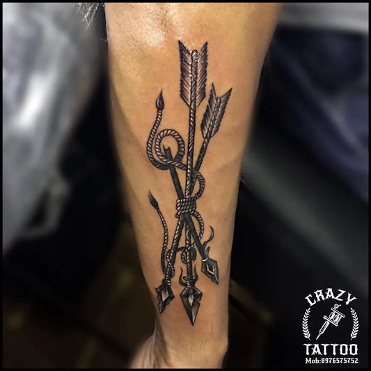 Medium Black and Grey Bundled Arrows with Snake Tattoo on Men Arm by @jayeshbhanushali_artist
