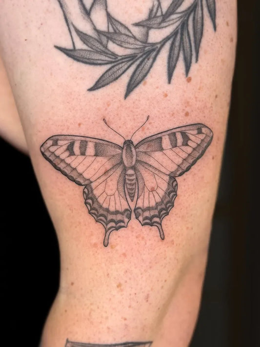 Medium Black and Grey Butterfly Tattoo on Women Upper Arm by @heidikayetattoo