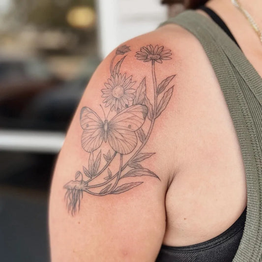 Medium Black and Grey Butterfly and Daisies Tattoo on Women Shoulder by @sirenisea