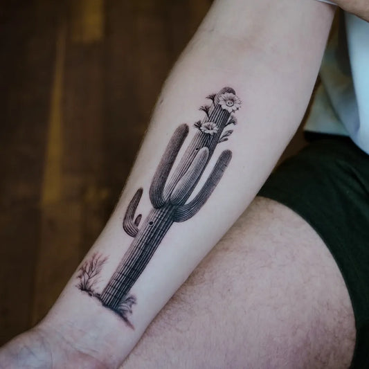Medium Black and Grey Cactus and Flowers Tattoo on Women Arm by @indira_txttoos