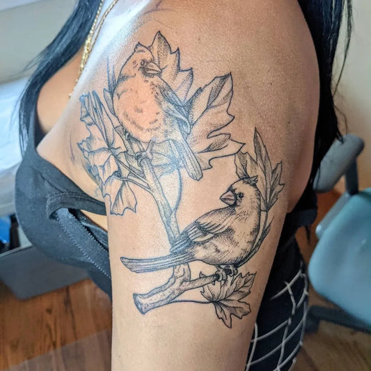Medium Black and Grey Cardinals and Maple Leaves Nature Tattoo on Women Shoulder by @hearthcreativestudios