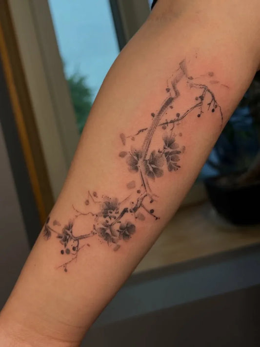 Medium Black and Grey Cherry Blossom Branch on Women Arm Tattoo by @harmlesskittytattoo
