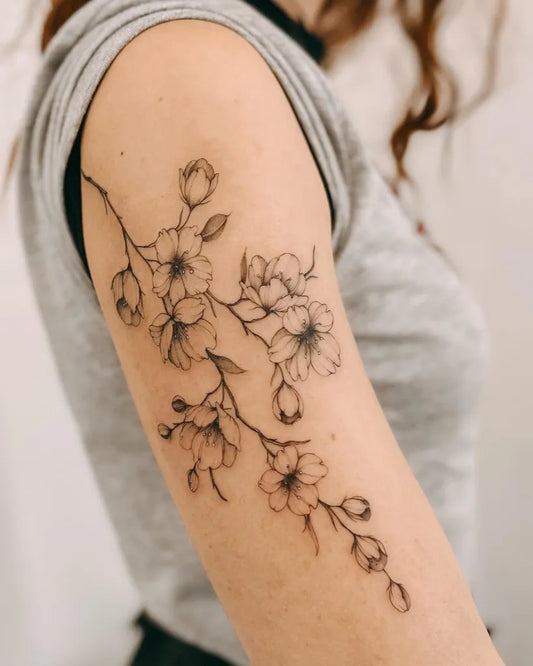 Medium Black and Grey Cherry Blossom Branch on Women Arm Tattoo by @kay.tattooing