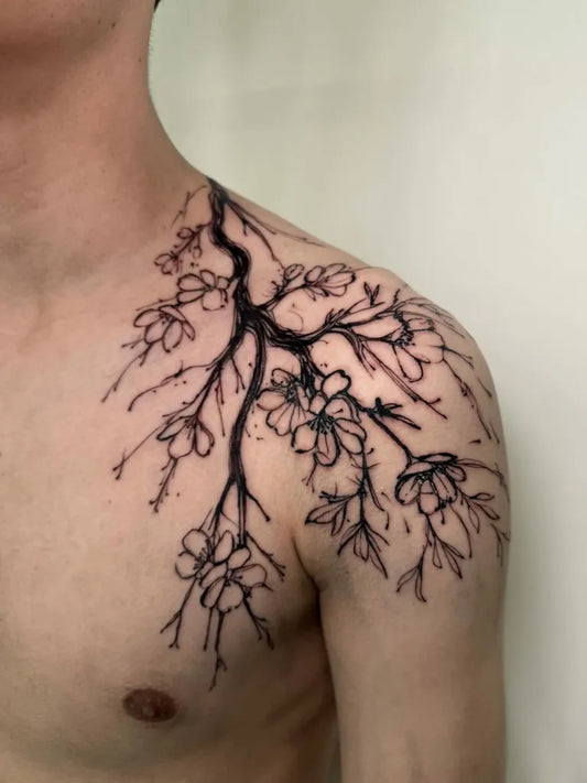 Medium Black and Grey Cherry Blossom Branches on Men Shoulder Tattoo by @tabeatraebert_tattoo