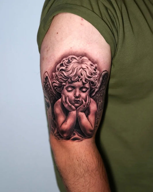 Medium Black and Grey Cherub Tattoo on Men Arm by @smileyartla