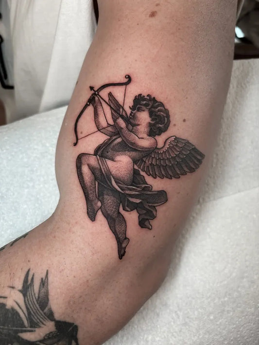 Medium Black and Grey Cherub with Bow and Arrow Tattoo on Men Upper Arm by @___soyboy