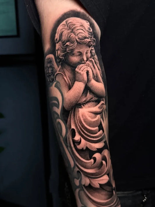 Medium Black and Grey Cherub with Wings Tattoo on Men Arm by @reyr1tattoo