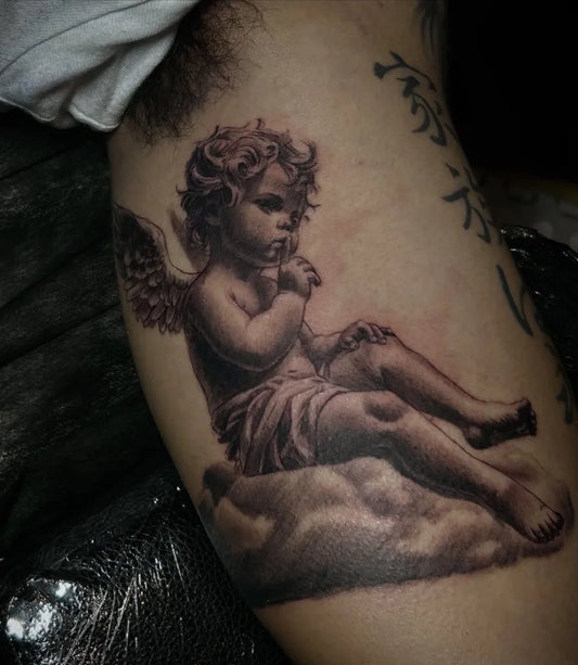 Medium Black and Grey Cherub with Wings and Clouds Tattoo on Men Arm by @cginks