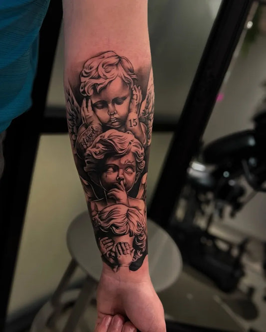 Medium Black and Grey Cherubs Tattoo on Men Arm by @aloha.tattoos