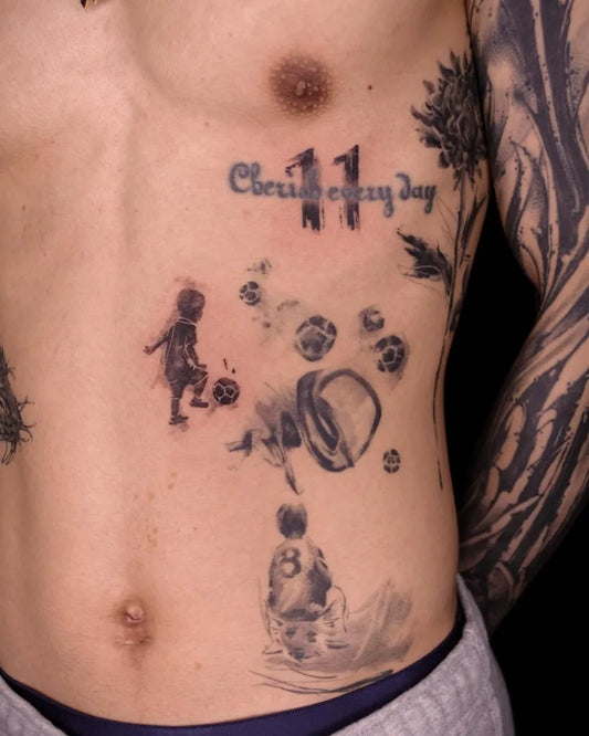 Medium Black and Grey Child Playing Soccer Tattoo on Men Rib by @vocozun