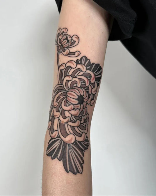 Medium Black and Grey Chrysanthemum Tattoo on Women Arm by @valentin.tatau