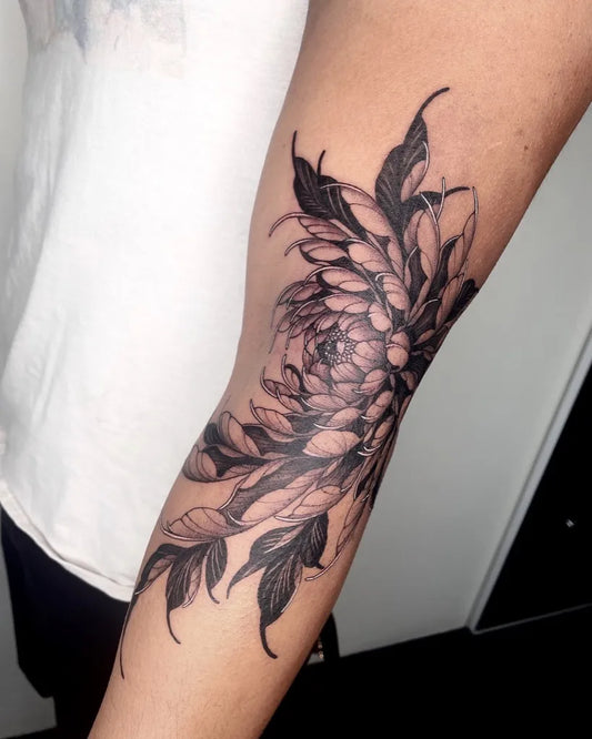 Medium Black and Grey Chrysanthemum and Leaves Tattoo on Women Arm by @nizi_tattoo