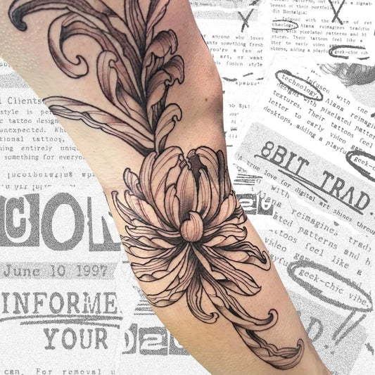 Medium Black and Grey Chrysanthemum with Newspapers Tattoo on Women Arm by @alanarosetattoos