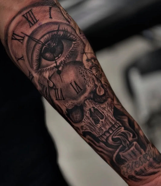 Medium Black and Grey Clock Eye Skull Tattoo on Men Arm by @josetattoos.nyc.studio