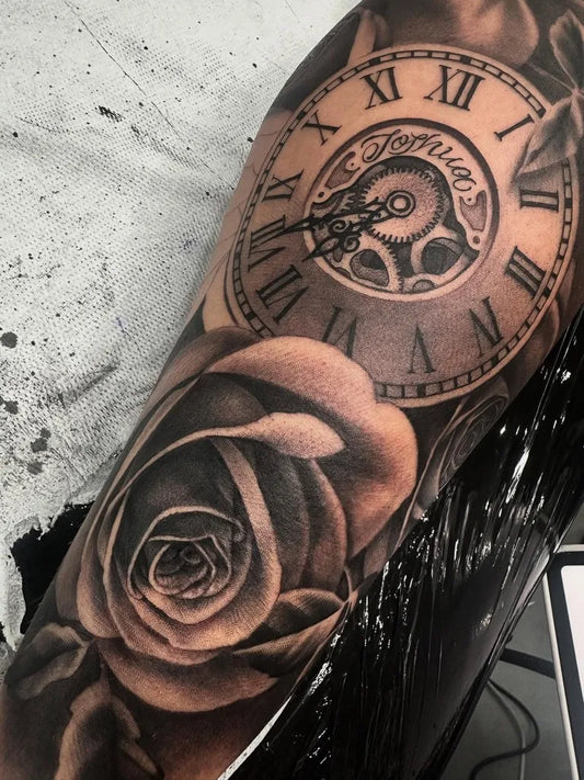 Medium Black and Grey Clock and Rose Tattoo on Men Arm by @mistercoletattoo