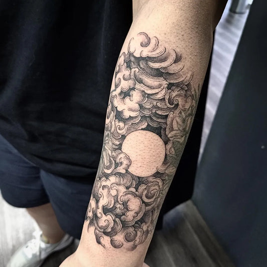 Medium Black and Grey Cloud and Moon Tattoo on Men Arm by @jeffchewtattoostudio