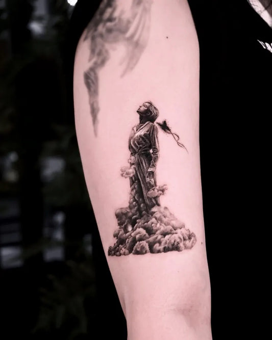 Medium Black and Grey Cloudy Figure Tattoo on Women Arm by @midam.tattoo