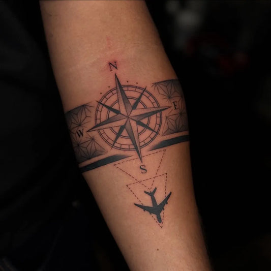 Medium Black and Grey Compass Airplane on Men Forearm Tattoo by @sea_of_ink_tattoo_studio