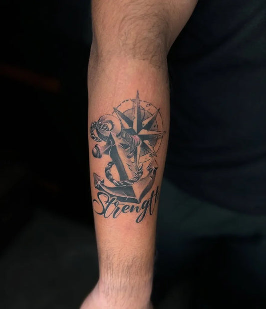 Medium Black and Grey Compass Anchor Strength on Men Arm Tattoo by @tattoo_villa